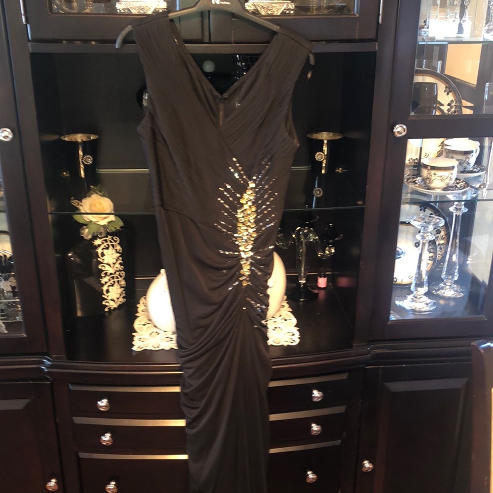 Black gown with gold gems along the left side